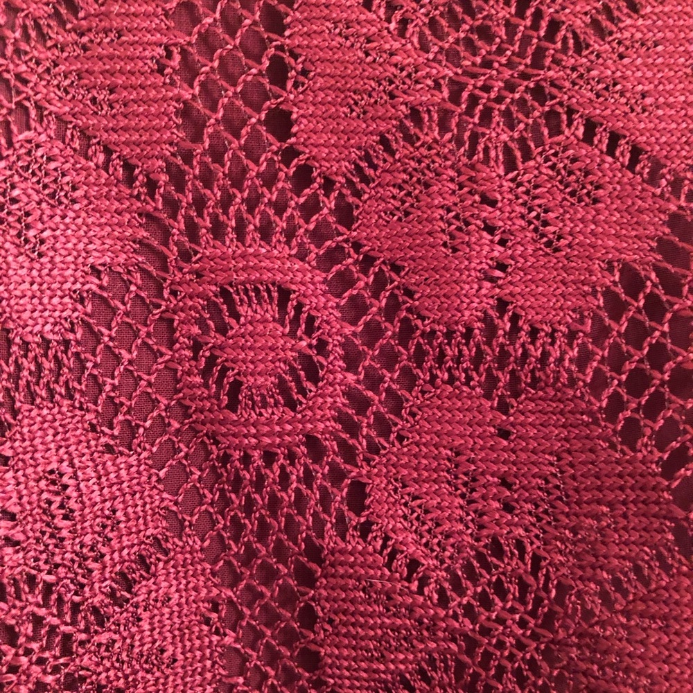 Layered burgundy tank top with floral lace accent
